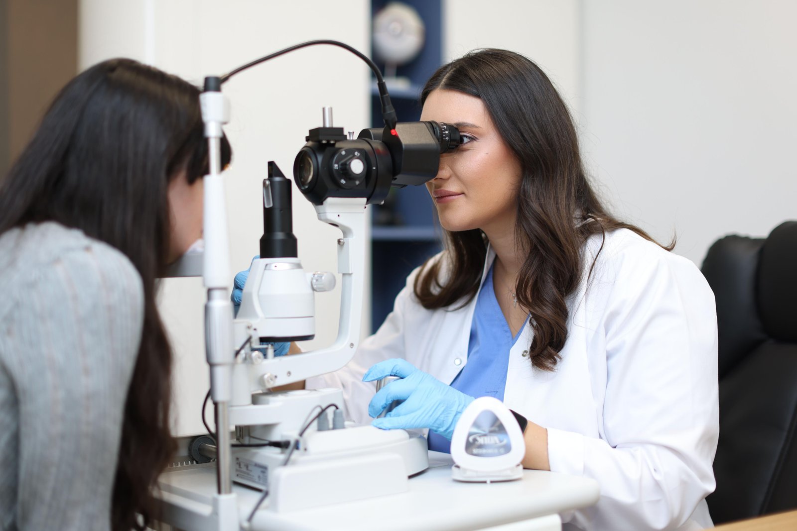 Eye specialist examining patient